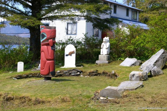 Carvings and statues at the entrance to totem pole park in Ketchikan.jpg
