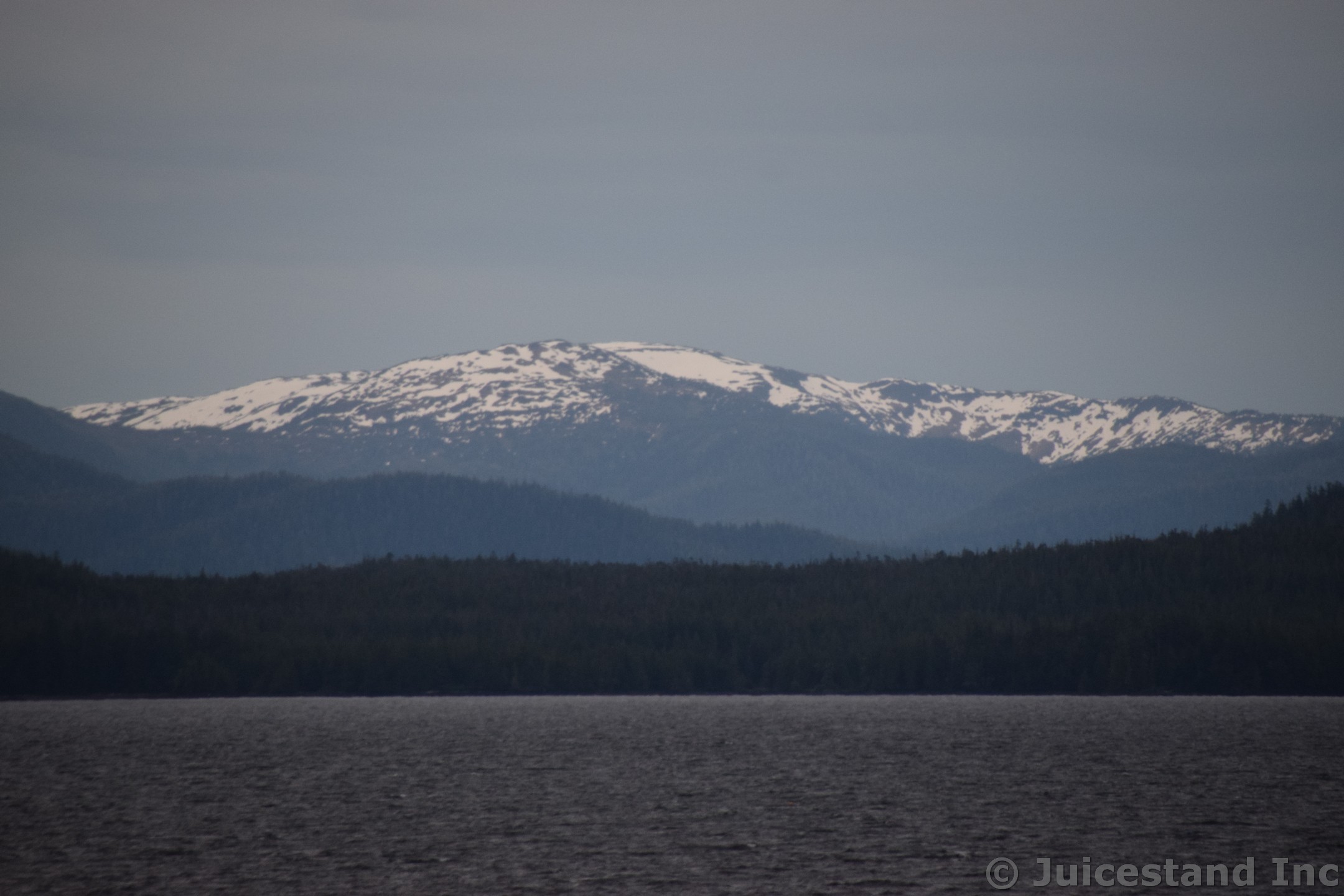Snow Peaked Moutains and Alpine Forests near Ketchikan Alaska
