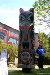Chubby lady next to totem pole in Ketchikan.jpg
