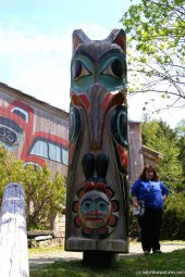 Chubby lady next to totem pole in Ketchikan.jpg