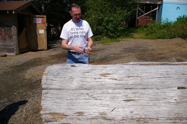 Ketchikan tour guide and old cedar tree trunk.jpg
