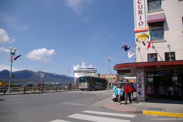 NCL Pearl in the distance on the street of Ketchikan.jpg
