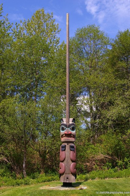 Totem pole with tall stick on top in Ketchikan.jpg
